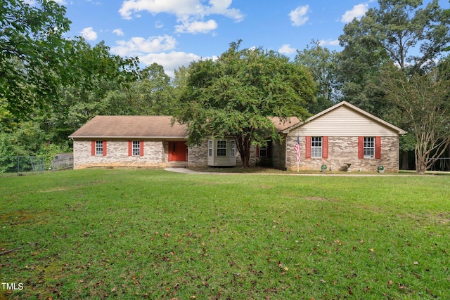 ranch-style home with a front yard