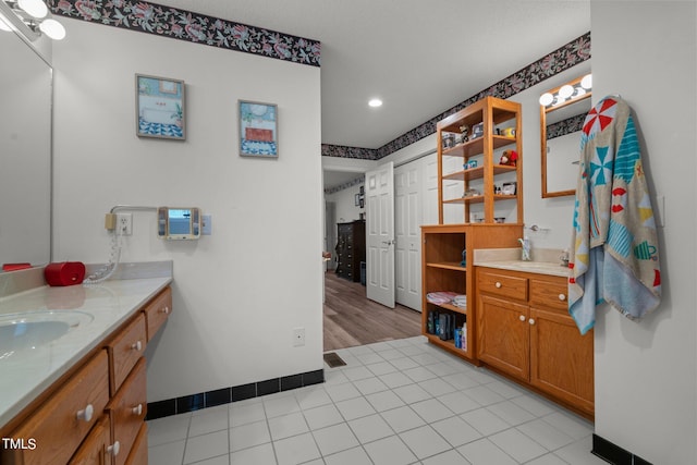 bathroom with vanity and hardwood / wood-style floors