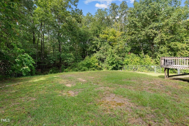 view of yard featuring a wooden deck