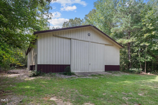 exterior space with a lawn and an outbuilding