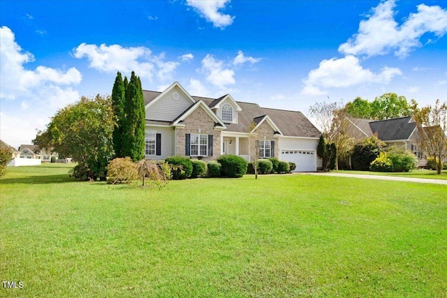 view of front of property with a garage and a front lawn