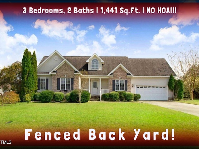 view of front of property with a garage and a front lawn