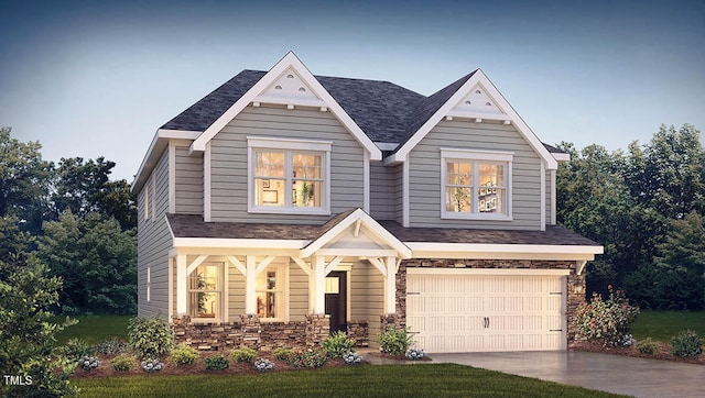 craftsman inspired home with a front yard and a garage