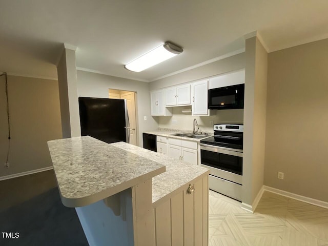 kitchen with ornamental molding, a kitchen bar, white cabinetry, and black appliances