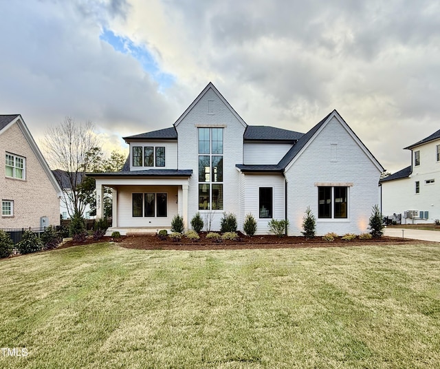 view of front of property with a front lawn