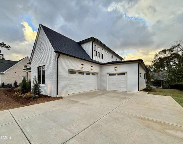 view of side of home with a garage