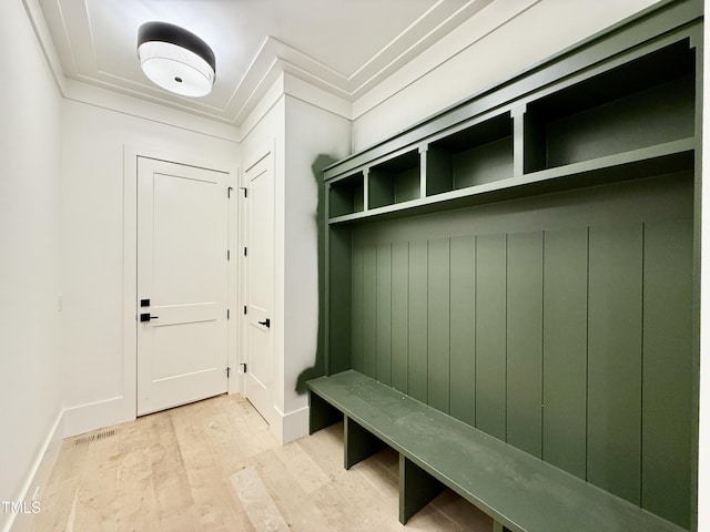 mudroom with light hardwood / wood-style floors