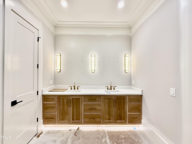 bathroom with crown molding and vanity