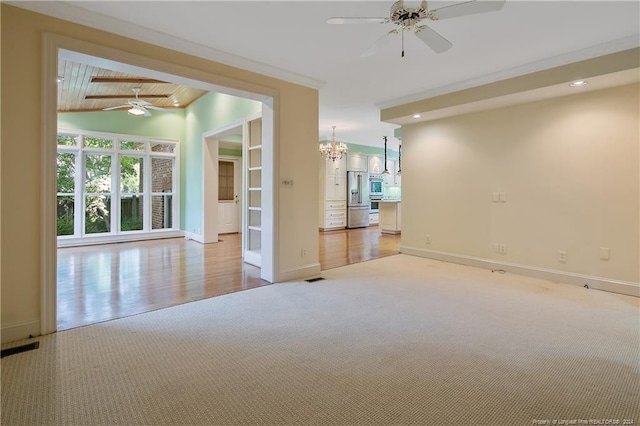 empty room featuring vaulted ceiling with beams, ceiling fan with notable chandelier, light wood-type flooring, and wooden ceiling