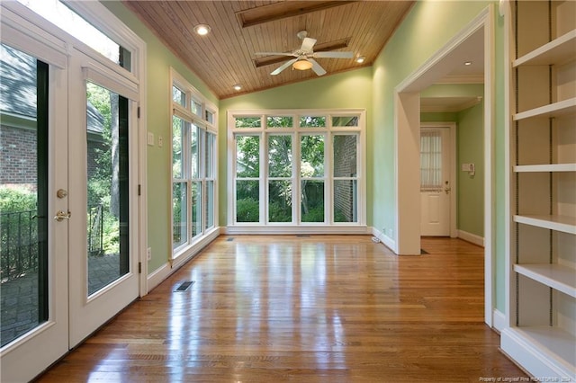 unfurnished sunroom with wooden ceiling, vaulted ceiling, ceiling fan, and french doors