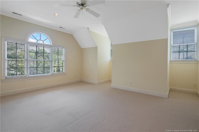 additional living space with ceiling fan, light carpet, and vaulted ceiling