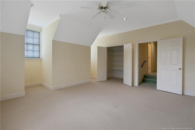 bonus room with vaulted ceiling, light carpet, and ceiling fan