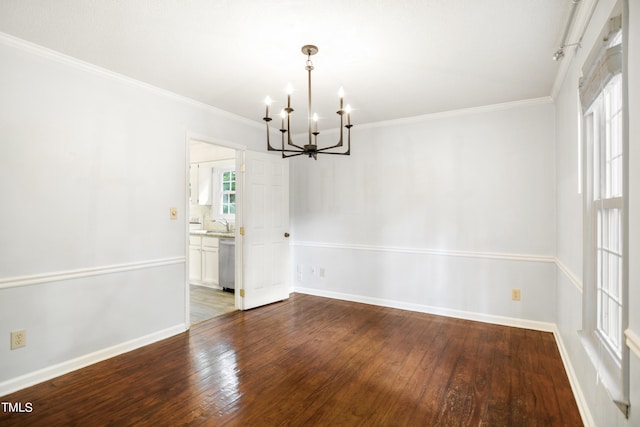 interior space with crown molding, hardwood / wood-style floors, and a notable chandelier