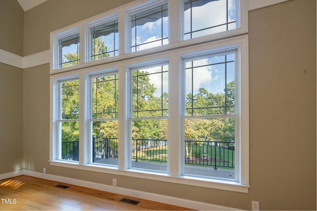 doorway to outside with plenty of natural light and hardwood / wood-style floors