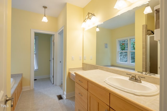 bathroom with separate shower and tub, tile patterned floors, and vanity