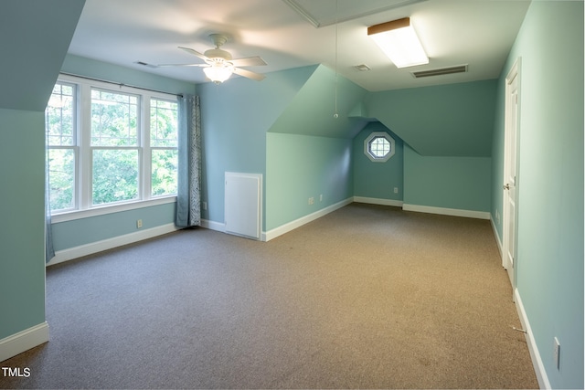 bonus room featuring light carpet, ceiling fan, and vaulted ceiling