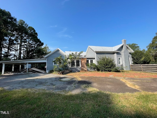 view of front of home with a carport