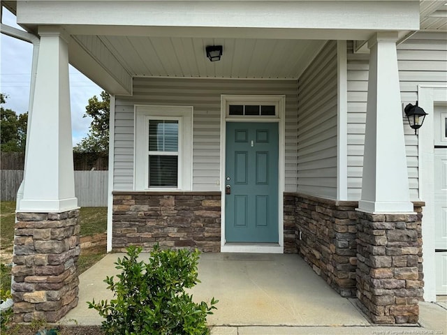 property entrance with covered porch