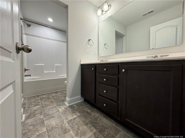 full bathroom with bathing tub / shower combination, vanity, and toilet