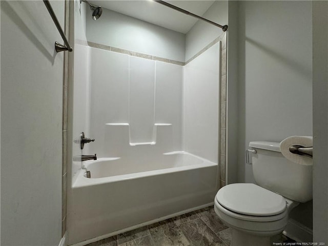 bathroom featuring bathtub / shower combination, wood-type flooring, and toilet