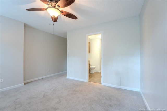 unfurnished bedroom featuring carpet flooring, baseboards, and ensuite bath