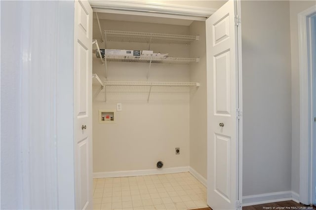 washroom with hookup for an electric dryer, laundry area, baseboards, and washer hookup