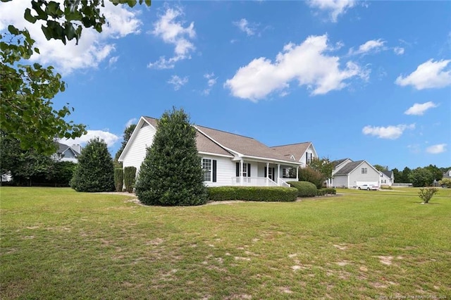 view of property exterior featuring a porch and a lawn