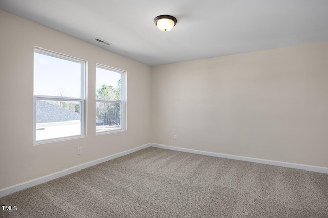 unfurnished room featuring carpet