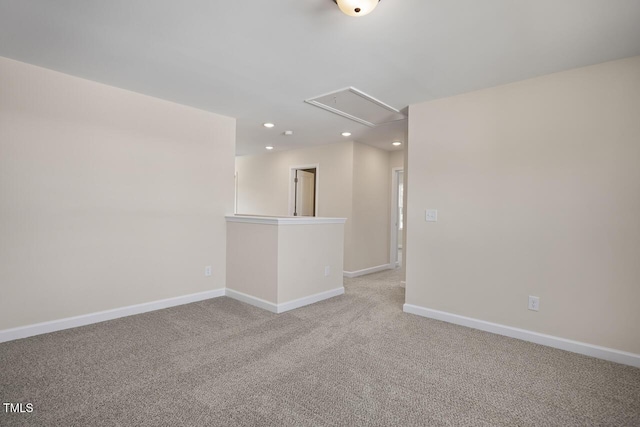 empty room featuring light carpet