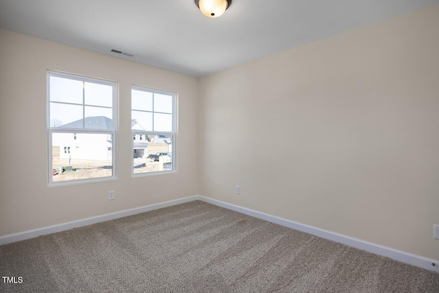 empty room featuring carpet flooring