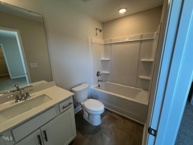 full bathroom featuring toilet, tub / shower combination, and vanity