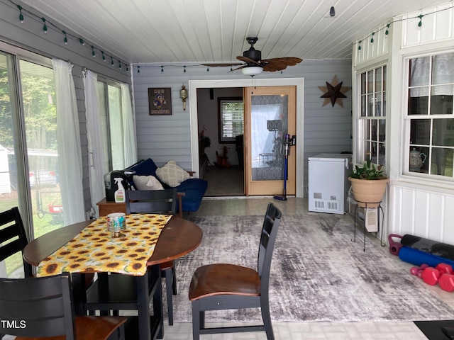 sunroom / solarium featuring wooden ceiling and ceiling fan