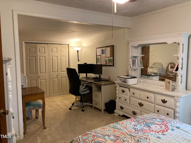 bedroom with light carpet, a closet, ornamental molding, and a textured ceiling