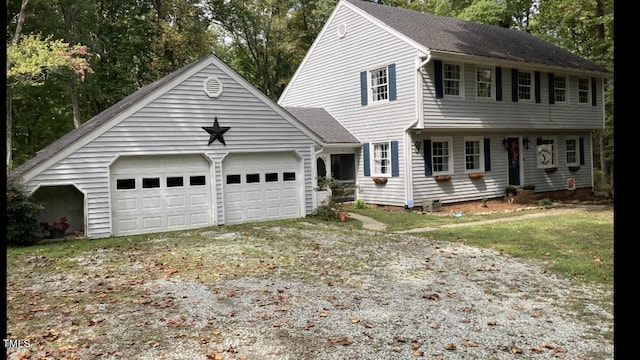 colonial inspired home featuring a garage