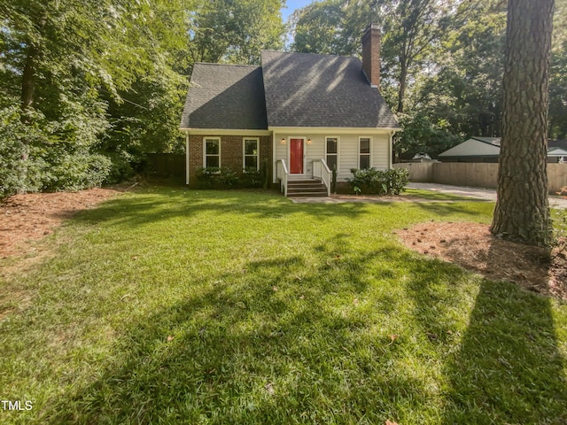 cape cod home with a front lawn