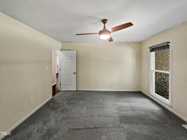 carpeted empty room featuring ceiling fan