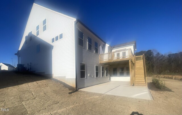 exterior space with a patio and central AC unit