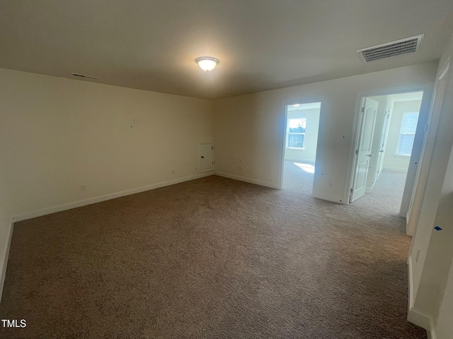 spare room with carpet floors