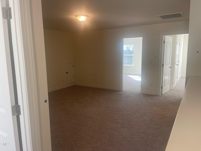 empty room featuring carpet floors