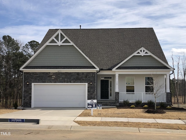 craftsman house with a garage and covered porch