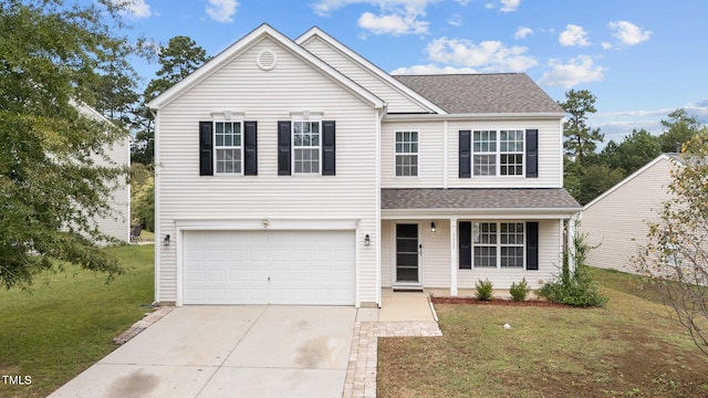 front of property with a front lawn and a garage