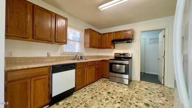 kitchen featuring dishwasher, stainless steel electric stove, sink, and a textured ceiling