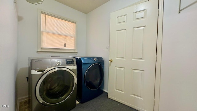 clothes washing area featuring washing machine and dryer