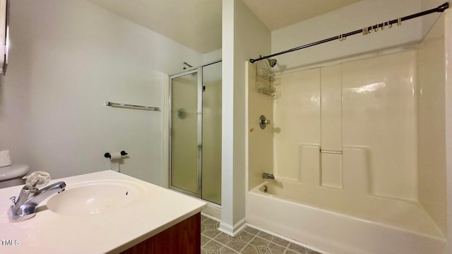 bathroom with enclosed tub / shower combo and vanity