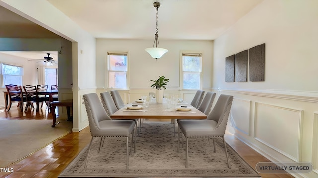 dining space featuring a wealth of natural light, ceiling fan, and wood-type flooring