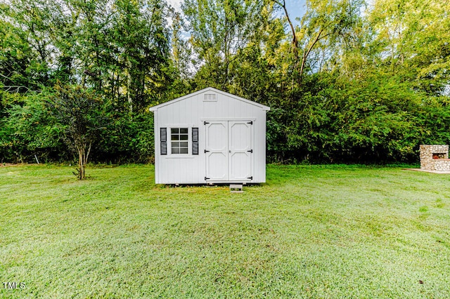 view of outdoor structure with a lawn