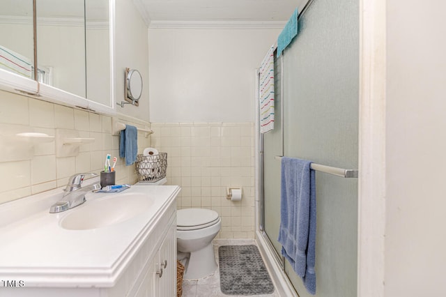 bathroom with vanity, tile walls, tile patterned floors, an enclosed shower, and toilet