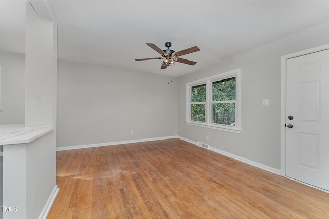 unfurnished room featuring light hardwood / wood-style floors and ceiling fan