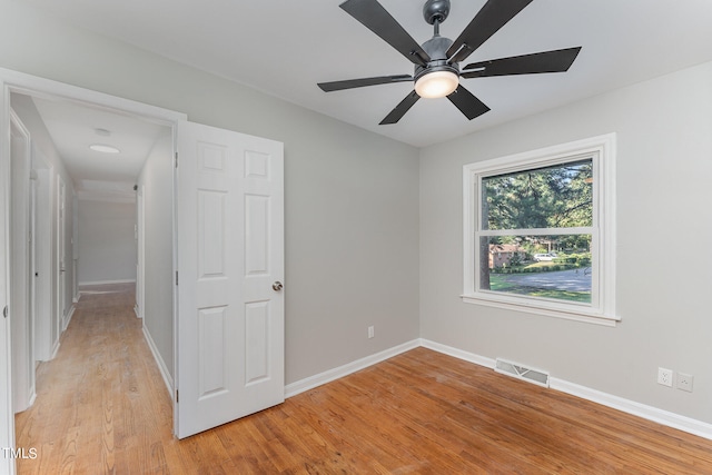 unfurnished bedroom featuring light wood-type flooring and ceiling fan