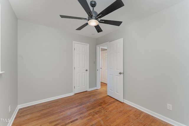 unfurnished bedroom featuring light hardwood / wood-style flooring and ceiling fan